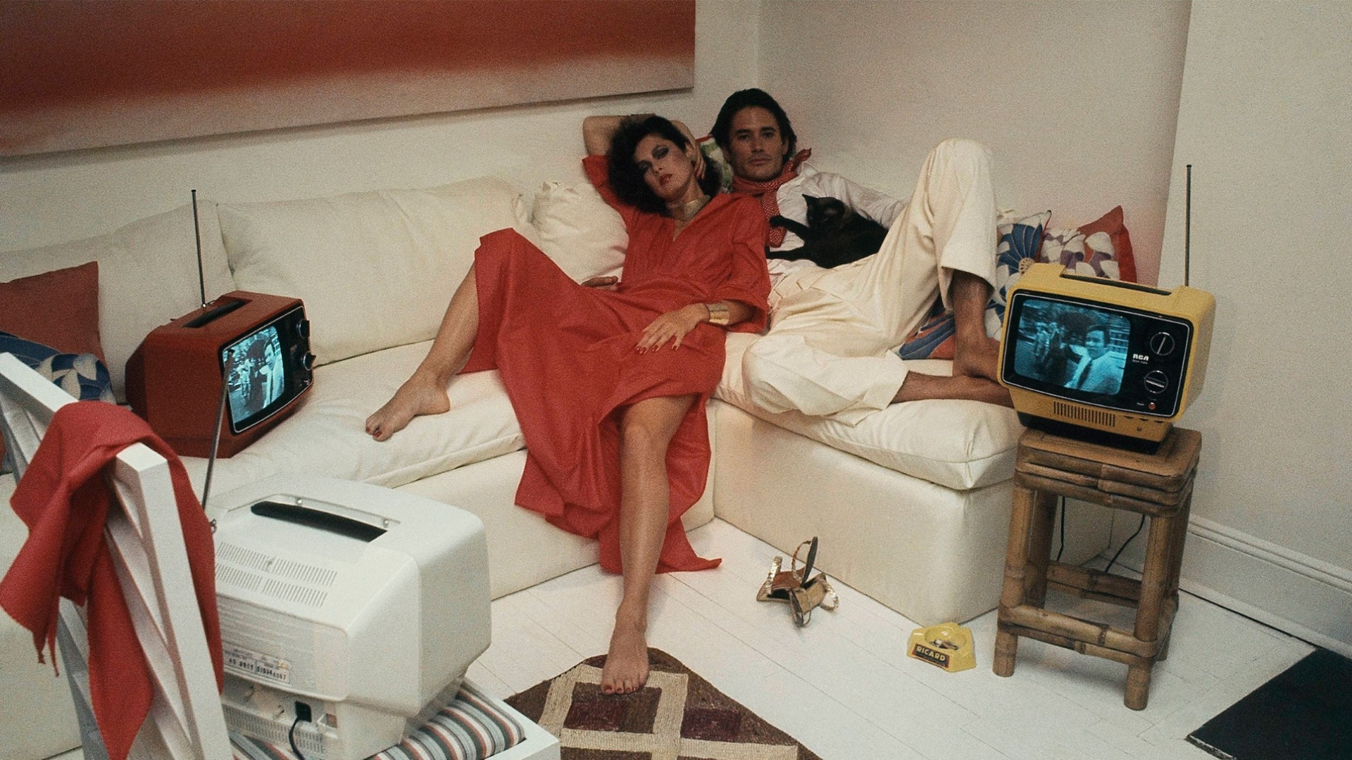 An image of a couple watching TV together