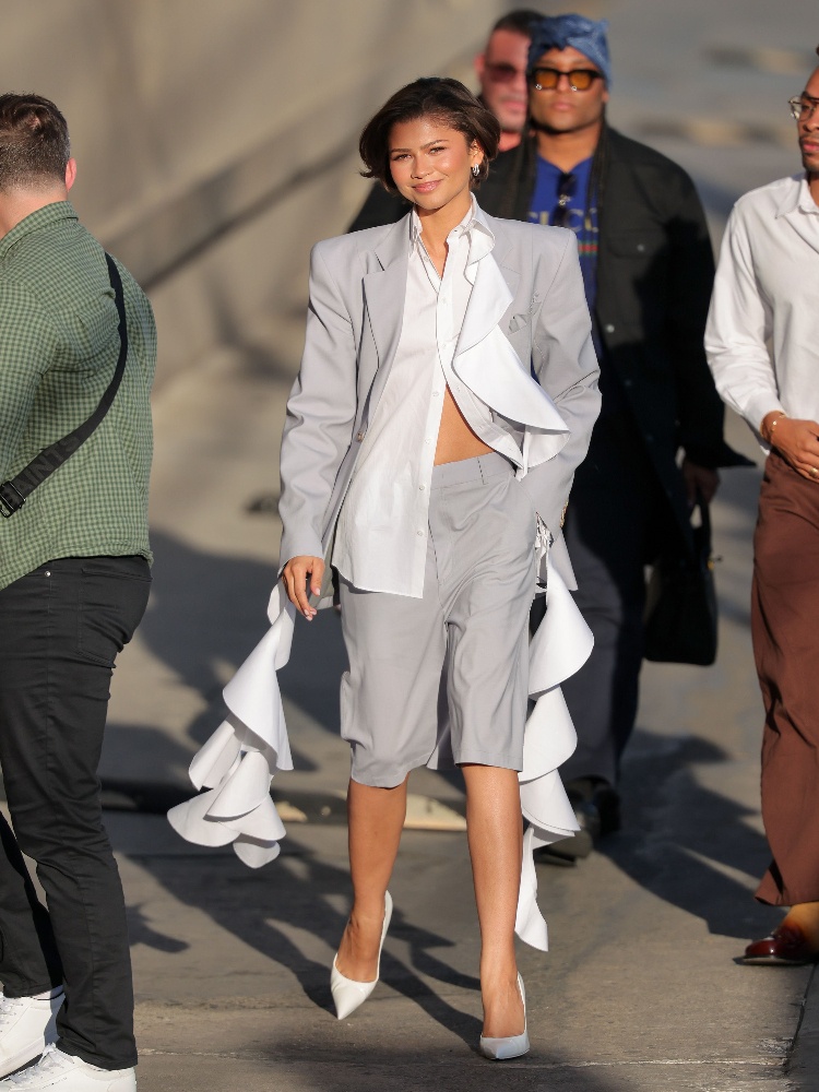 Zendaya in a grey Moschino suit set comprising tailored Bermuda shorts