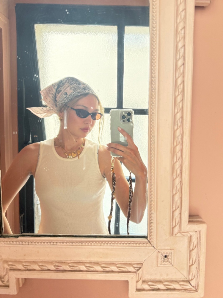 Gigi Hadid wearing a blue and white bandana