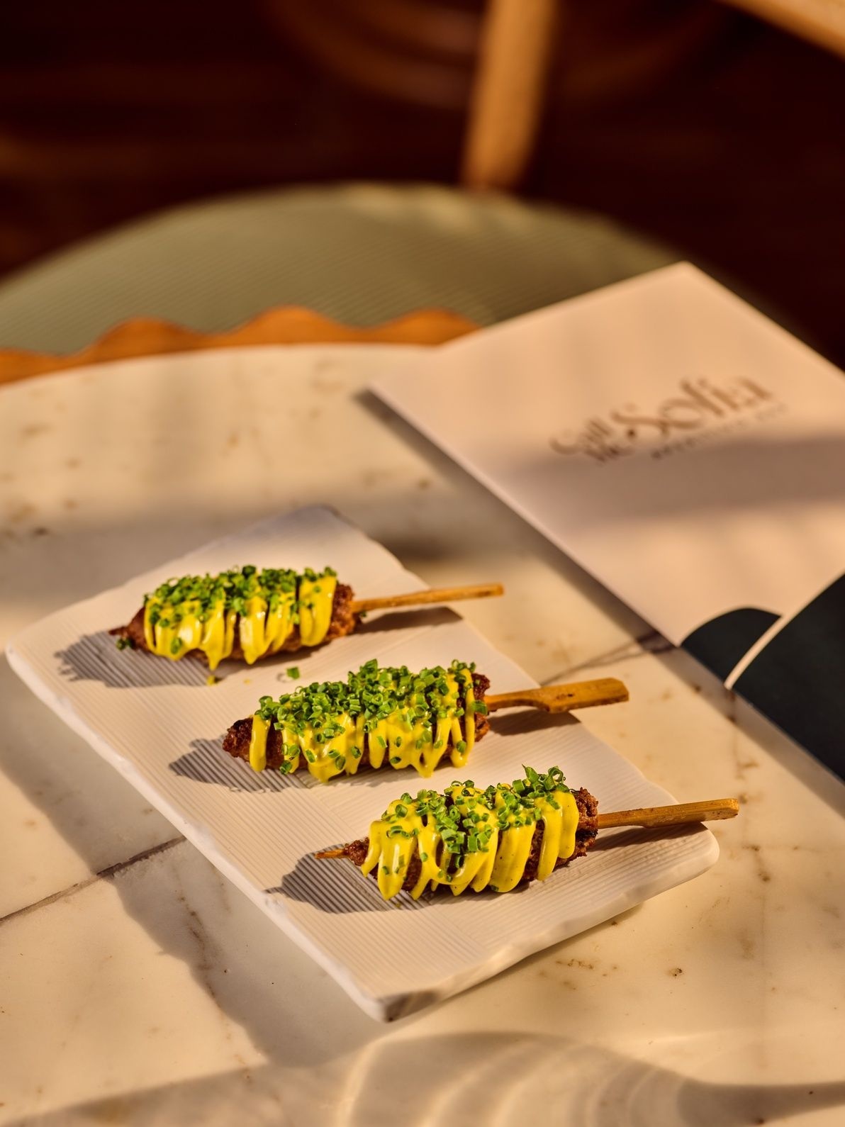 Grilled lamb skewers at Call Me Sofia, a new bar by the Olive Group in Khar