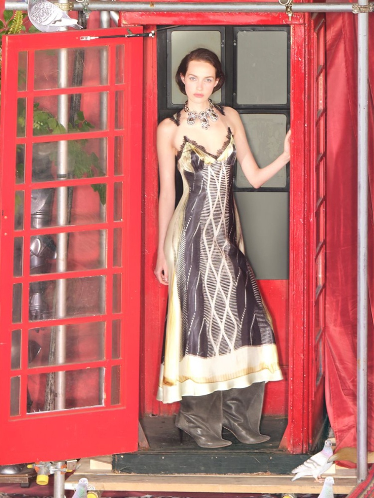 A model wearing a dress with invisible straps H&M Glenn Martens Collection