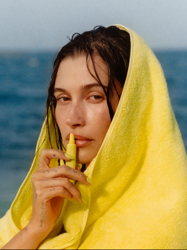 Hailey Bieber holding the viral Rhode Lemontini Lip Balm