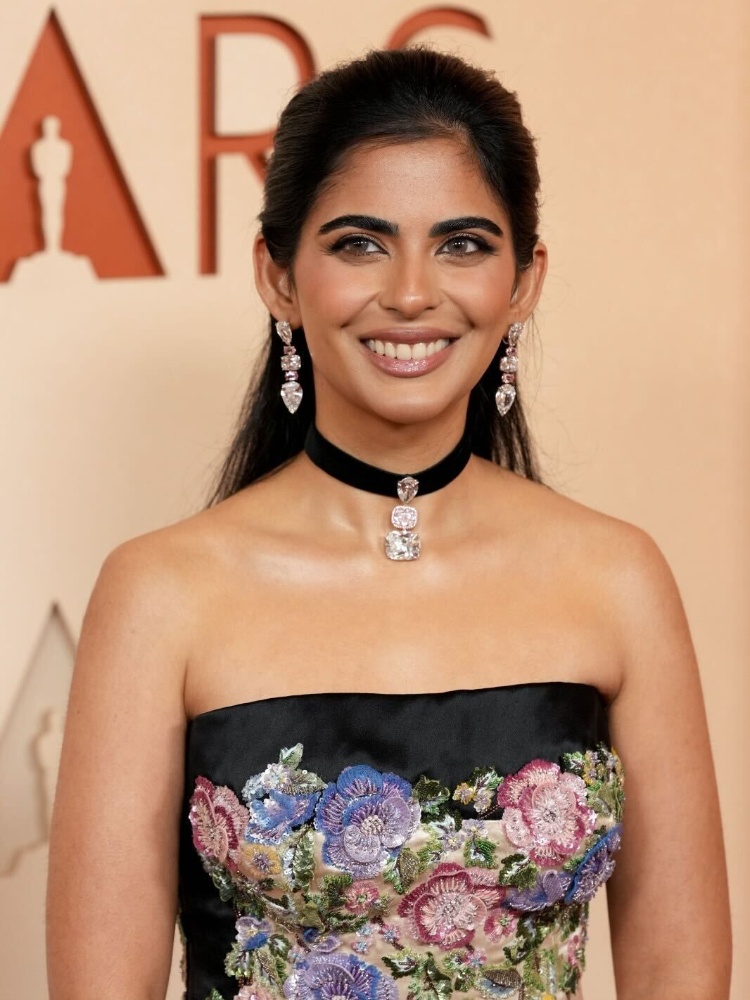 Isha Ambani at the 2026 Oscars red carpet wearing a vintage Valentino gown and Lorraine Schwartz diamond ribbon choker and earrings