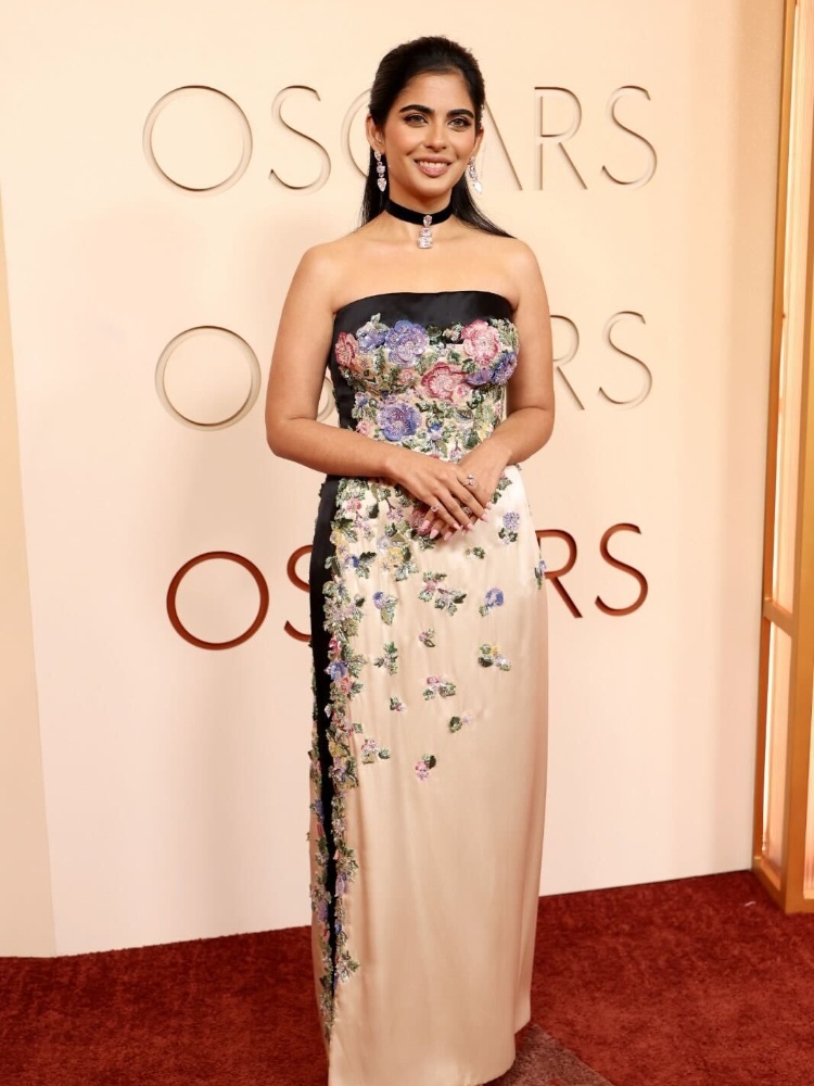 Isha Ambani at the 2026 Oscars red carpet wearing a vintage Valentino gown and Lorraine Schwartz diamond ribbon choker