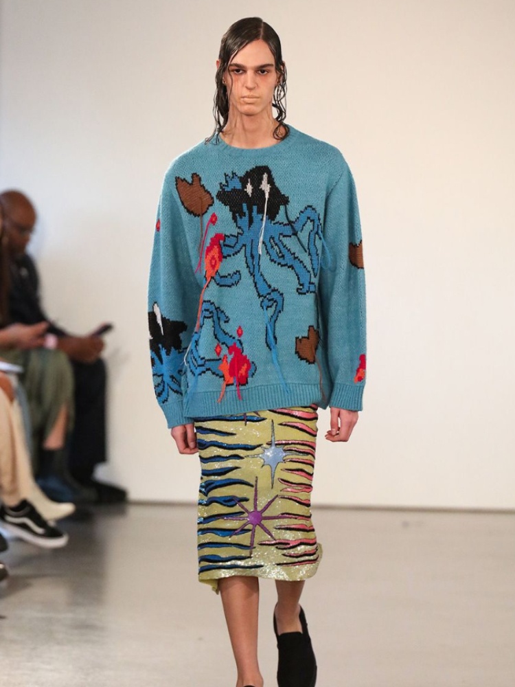 A model wearing KGL's blue Jojo knit pullover