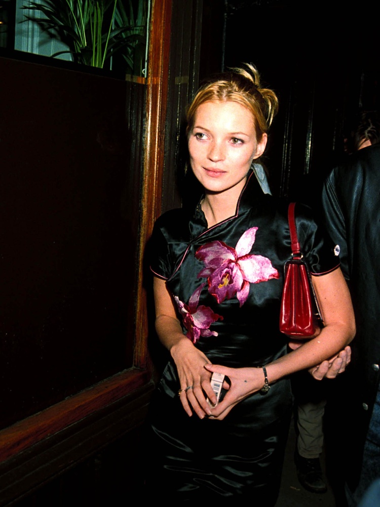 Kate Moss in a black cheongsam with pink flowers