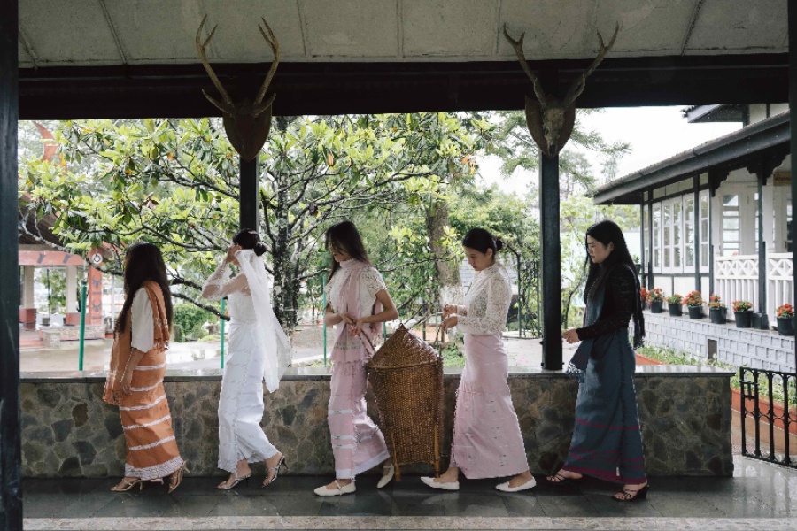 A campaign image from Kintem's Bonded collection showcasing a bride and her bridesmaids in contemporary Naga mekhelas