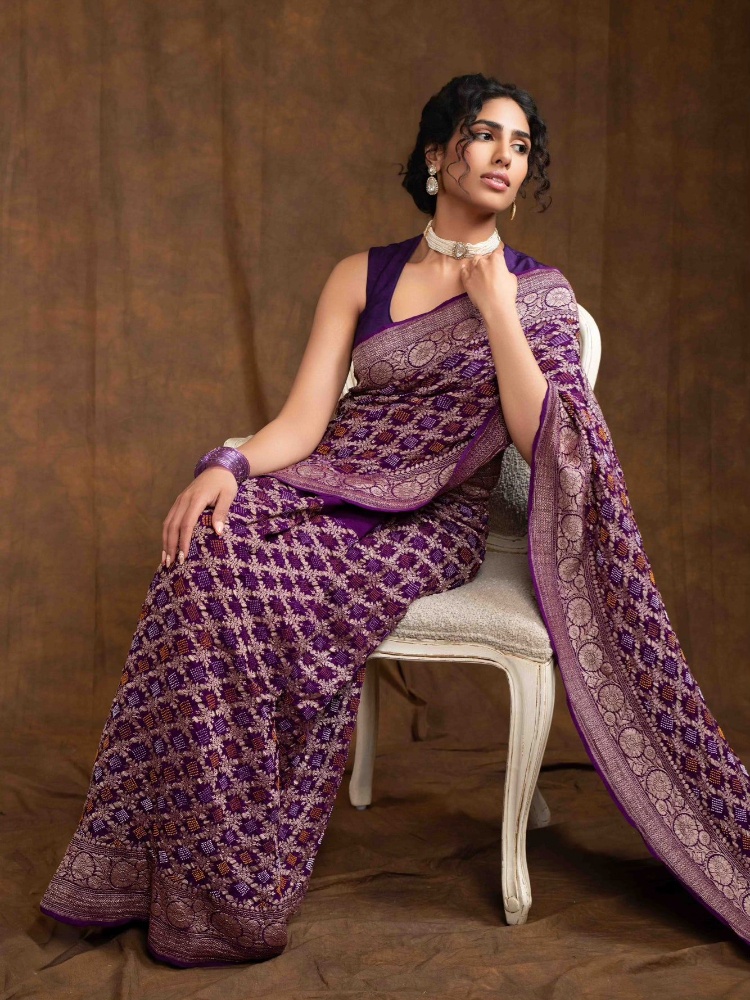A purple georgette bandhej sari from Kisseh by Dolly Jain
