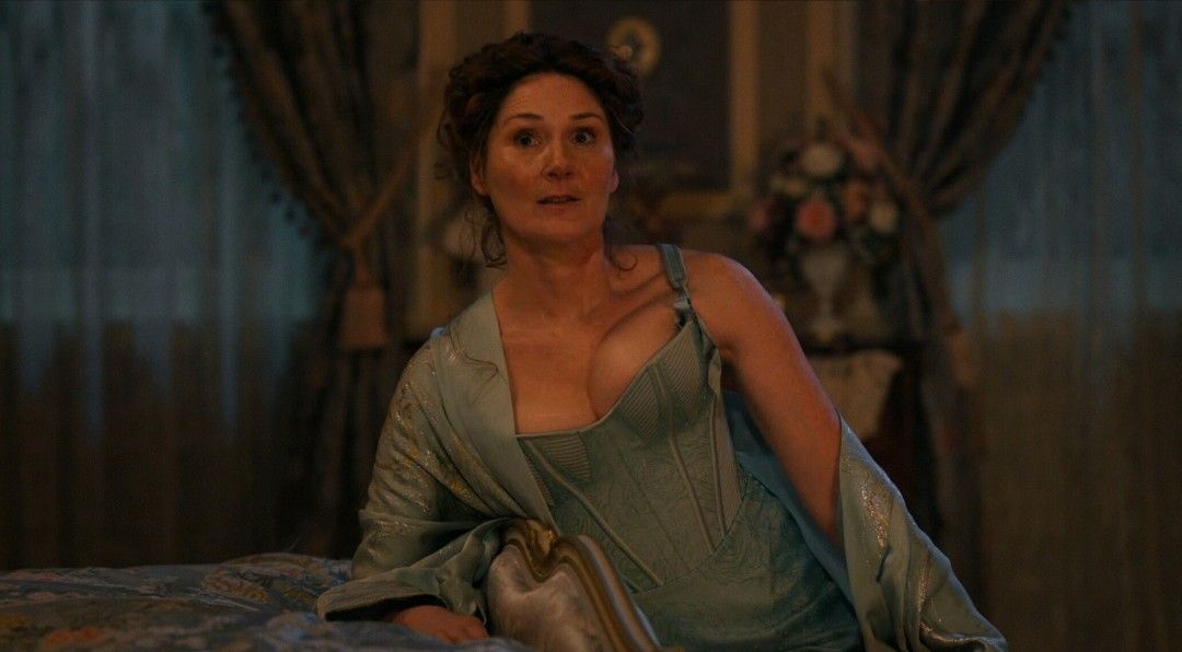 Lady Violet Bridgerton (Ruth Gemmell) in a matching corset, knickers, and robe in Season 4 of the Netflix show
