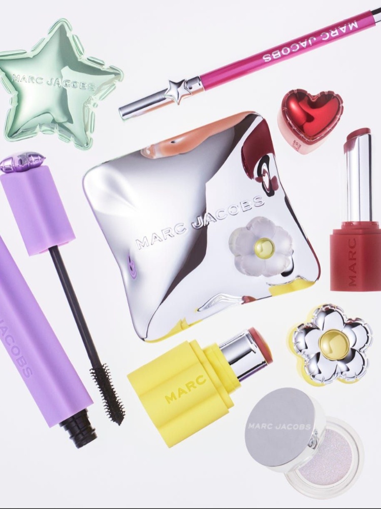 The new Marc Jacobs Beauty product lineup includes a mascara, an eyeliner, a bronzer, a blush stick, a lipstick, a highlighter, and eyeshadow