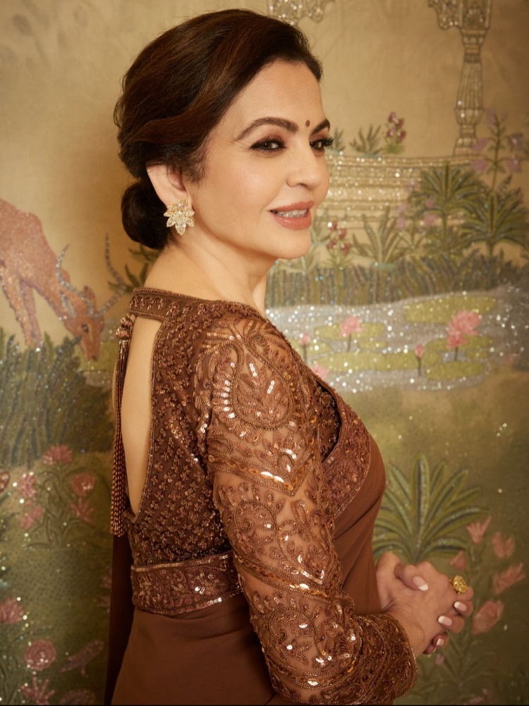 Nita Mukesh Ambani in a mocha sari and blouse by Manish Malhotra