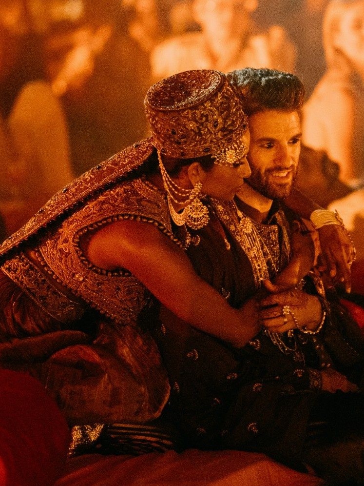 Nidhi and Noah's cultural night outfits by Divani