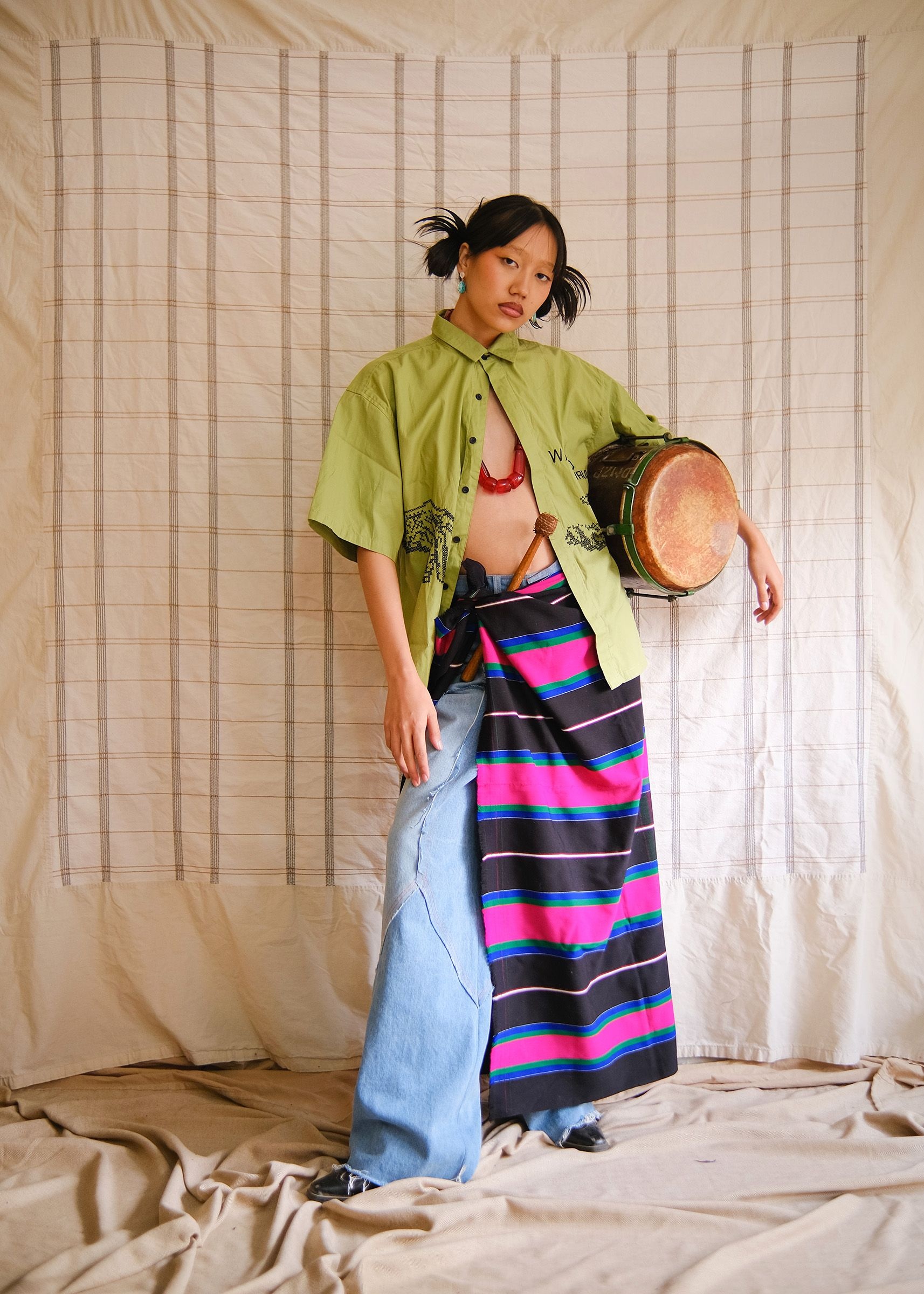 Maria Guite in Wasted Wrld shirt, Shia Rai jeans, BA puandum, Hannan Jewelry earrings