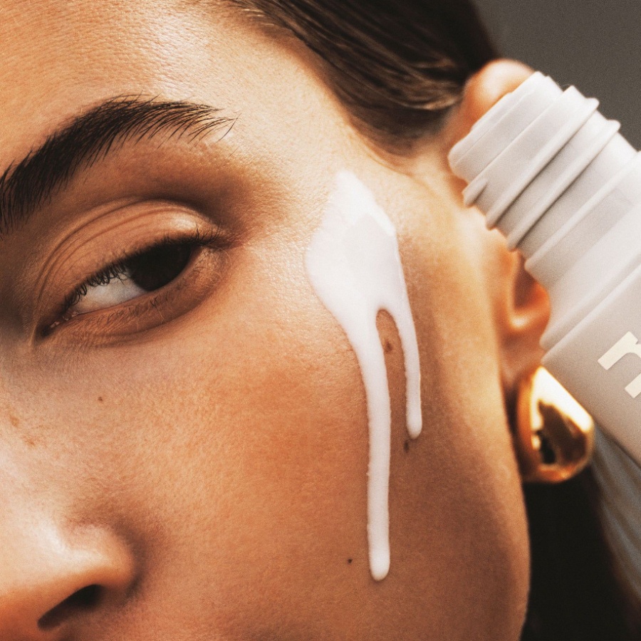 Hailey Bieber applying Rhode's glazing milk essence / toner