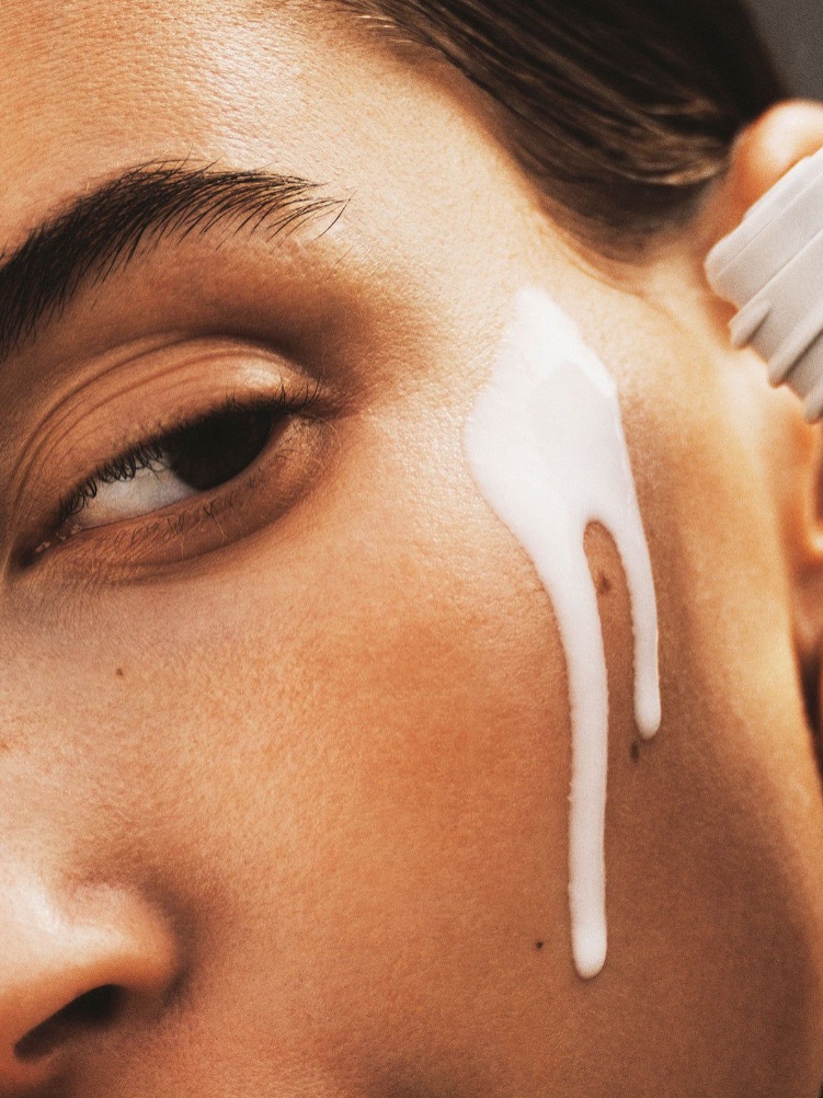 Hailey Bieber applying Rhode's glazing milk essence / toner