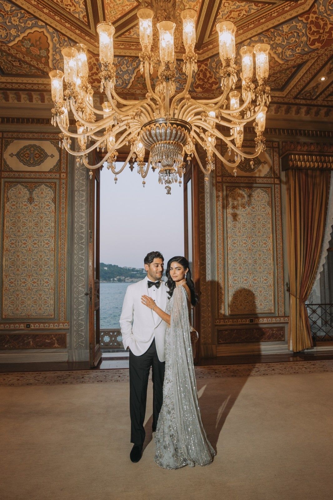 Sagiri in a Natasha Dalal fishtail gown with 3D florals and Ankur in a Ralph Lauren Purple Label tuxedo at their wedding reception