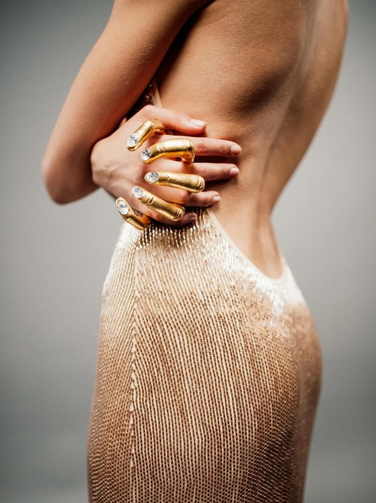 Schiaparelli's hand-in-hand ring, a palm cuff made with hammered gold brass and rhinestones for fingernails