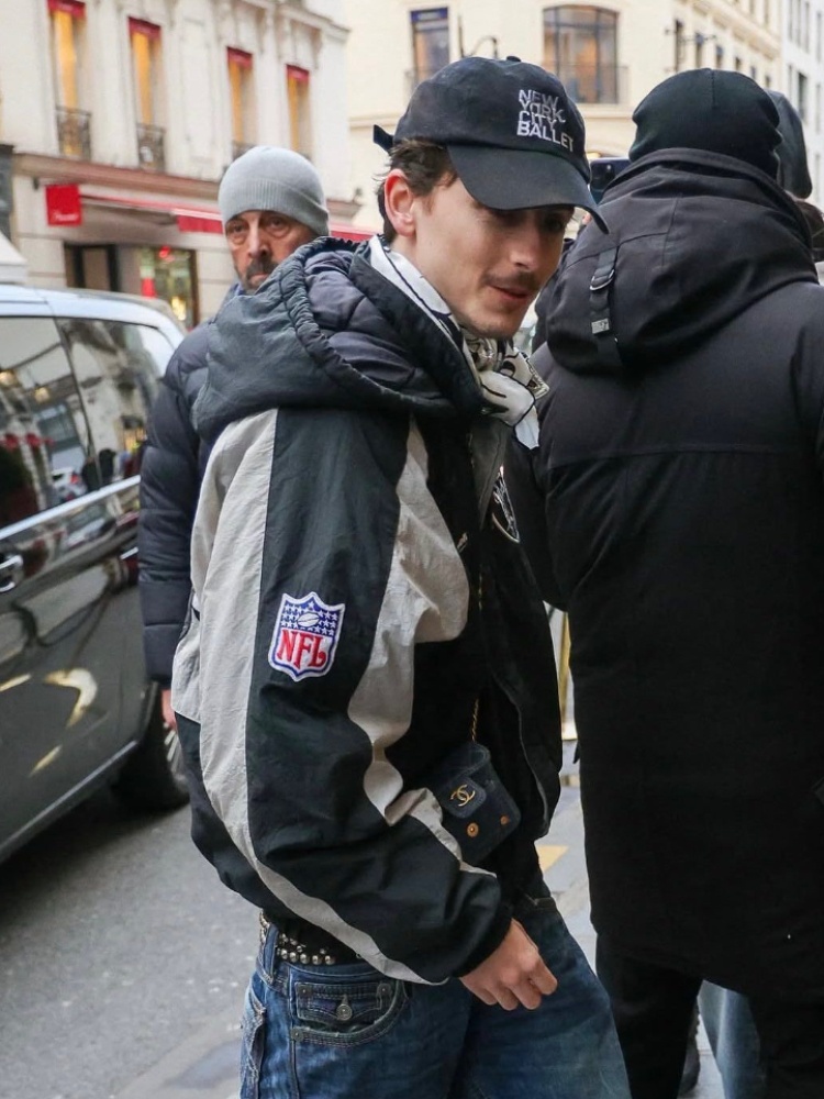 Timothee Chalamet wearing a tiny Chanel purse styled by Taylor McNeill