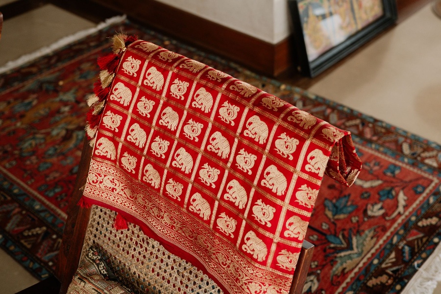 A red Shikargah sari by Sourav Das from Tina Tahiliani's wardrobe