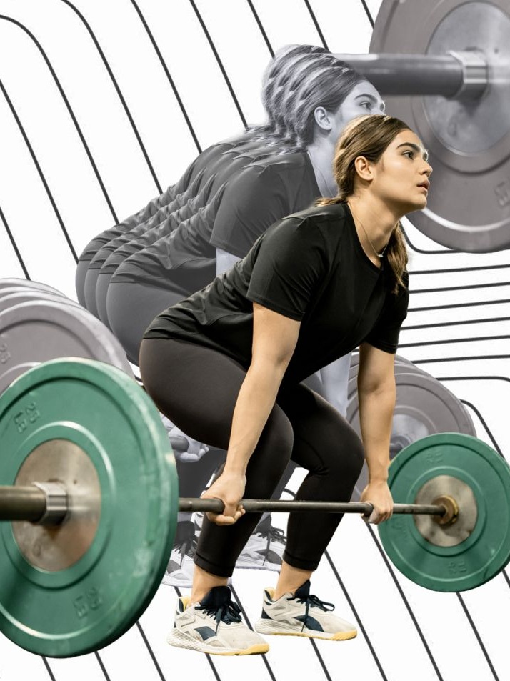A woman deadlifting at the gym