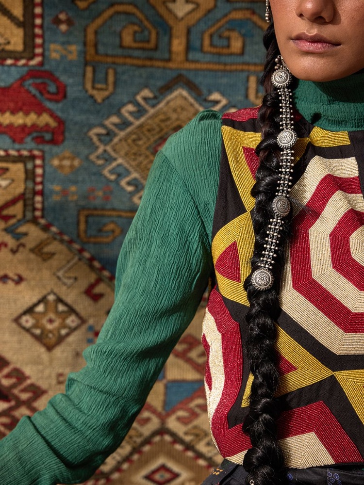 Anika in Payal Pratap bandhej pants; an Akaaro turtleneck; Ka-Sha beaded waistcoat; Pepper Coin jewellery