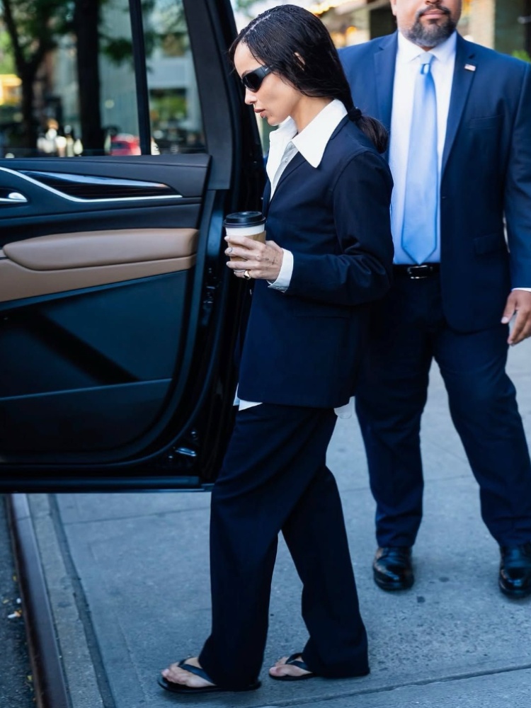 Zoë Kravitz in Ancient Greek Sandals flip flops and a suit amid the ’Caught Stealing’ press tour