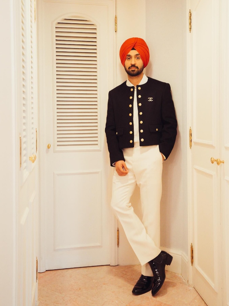 Punjabi artist Diljit Dosanjh in a Celine jacket worn with a Chanel brooch
