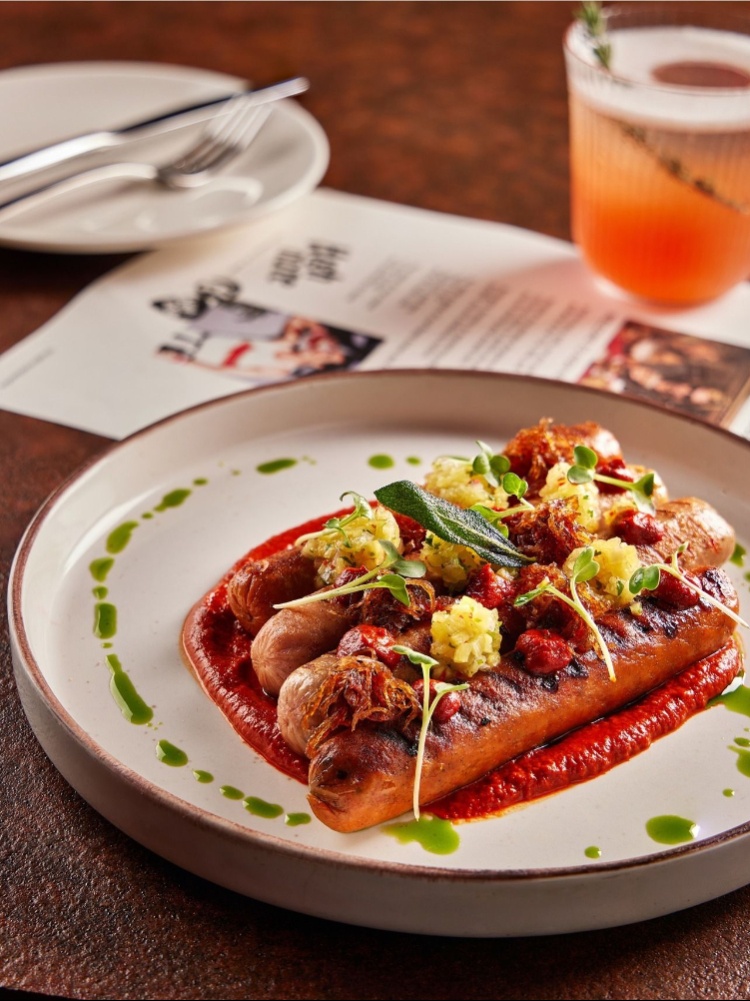triple- cooked pork sausages with miso caramelised onions and pineapple salsa, The Nod Mag