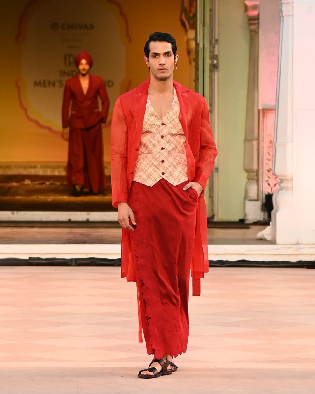 Red veshti from Vivek Karunakaran's Idam collection showcased at India Men's Weekend