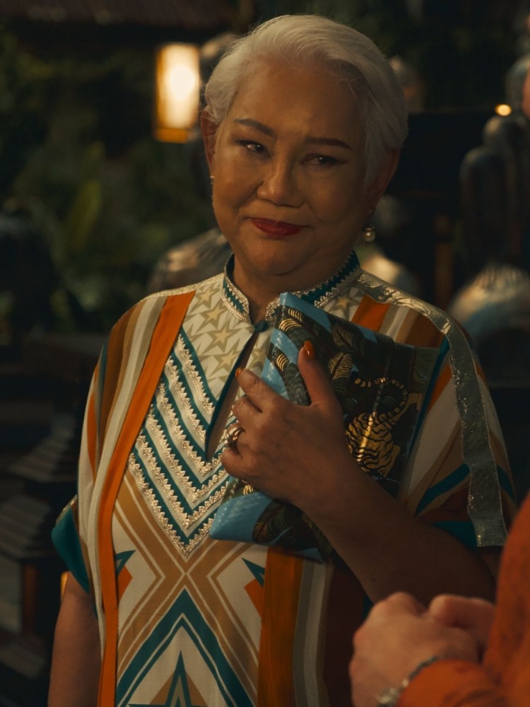 Lek Patravadi in a kaftan by Verandah in The White Lotus